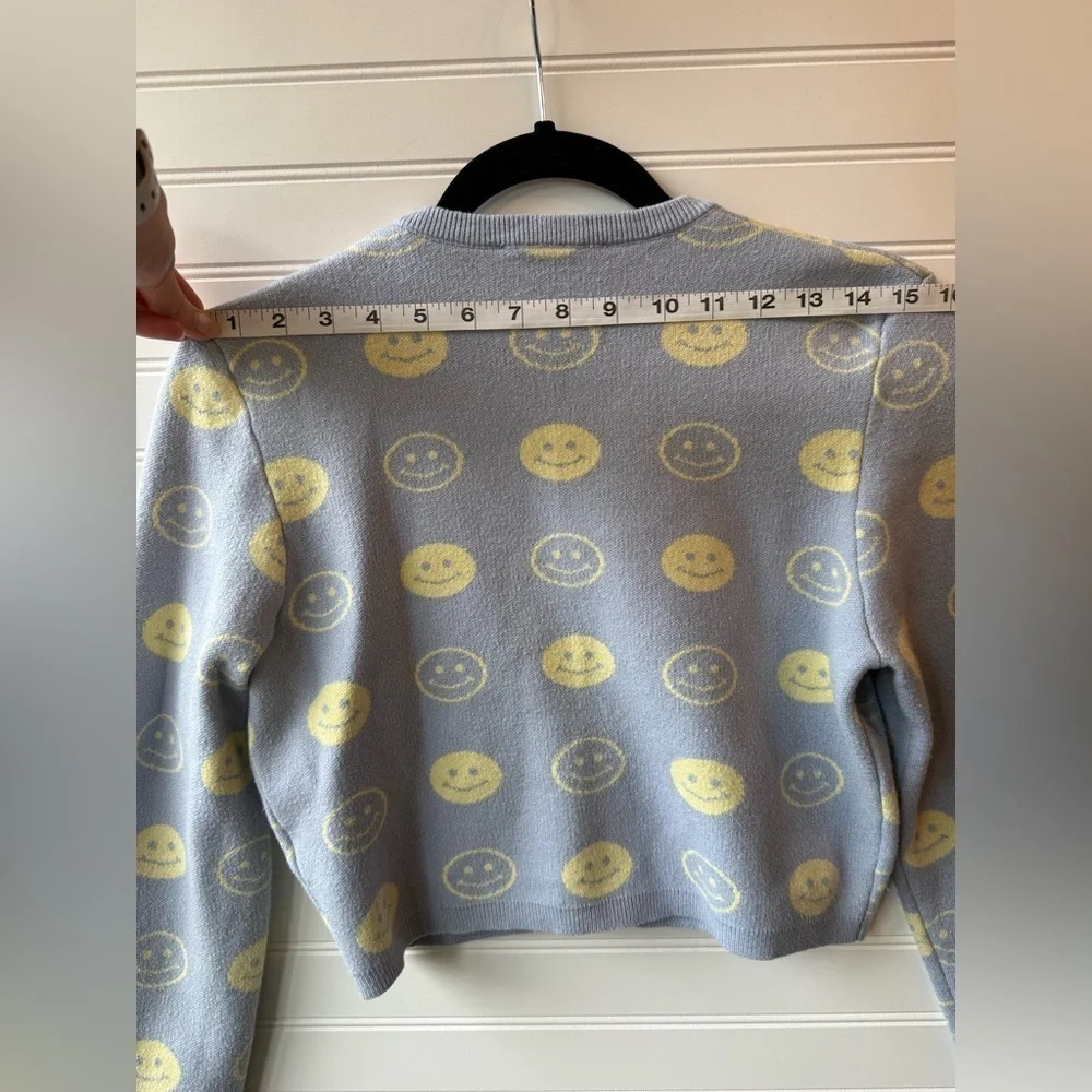 Bailey Rose cropped preppy smiley face sweater. Juniors size large.